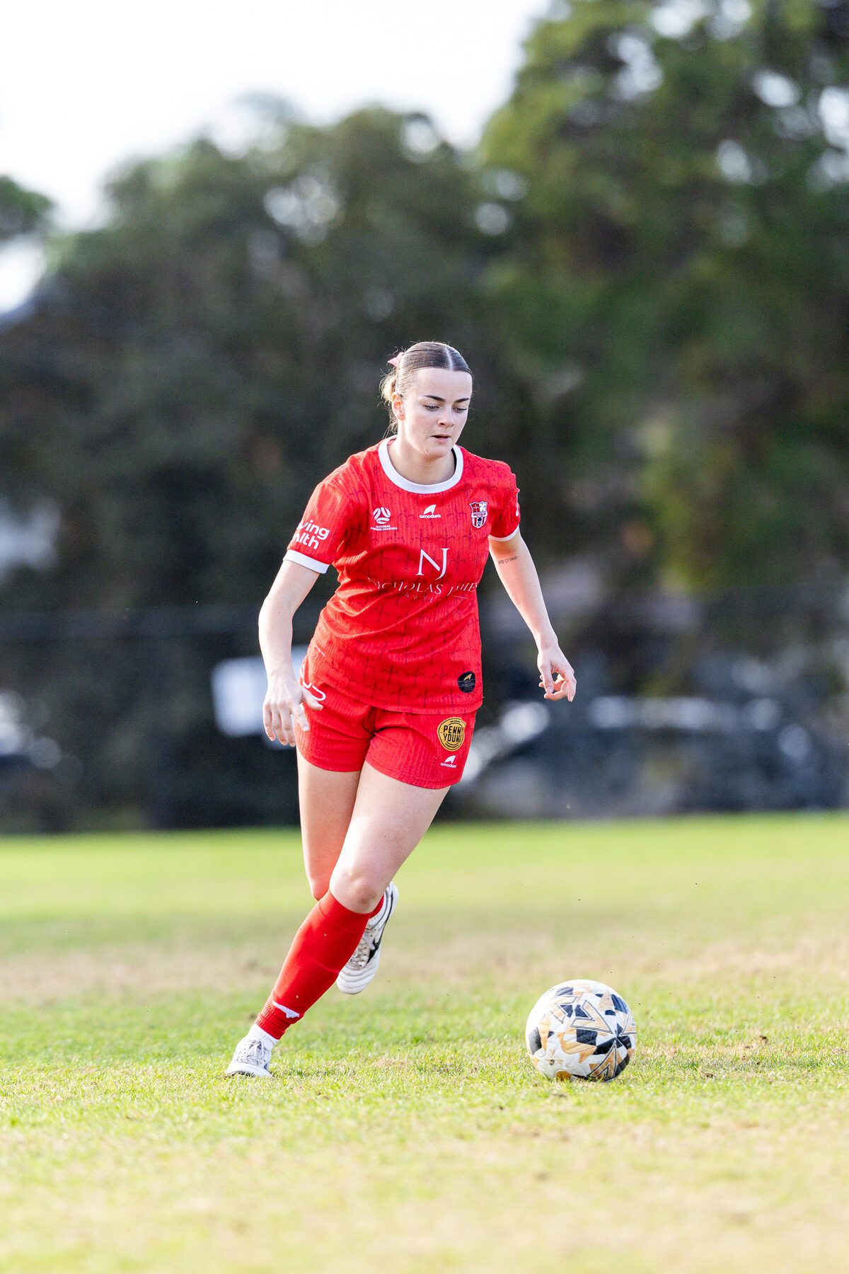 Essendon Royals senior women on the ball against South Melbourne